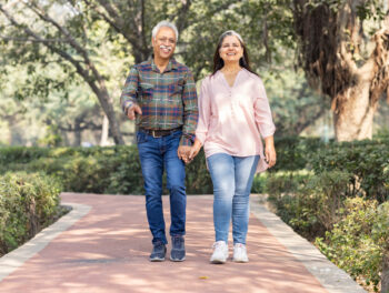 Happy senior couple spending leisure time in park.