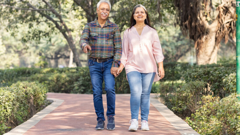 Happy senior couple spending leisure time in park.